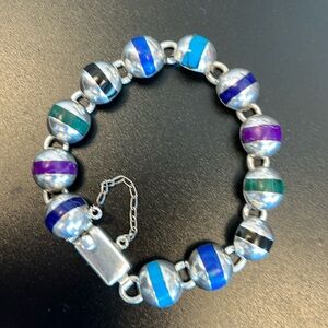 Rare-925 Sterling silver bracelet with gemstone inserts.